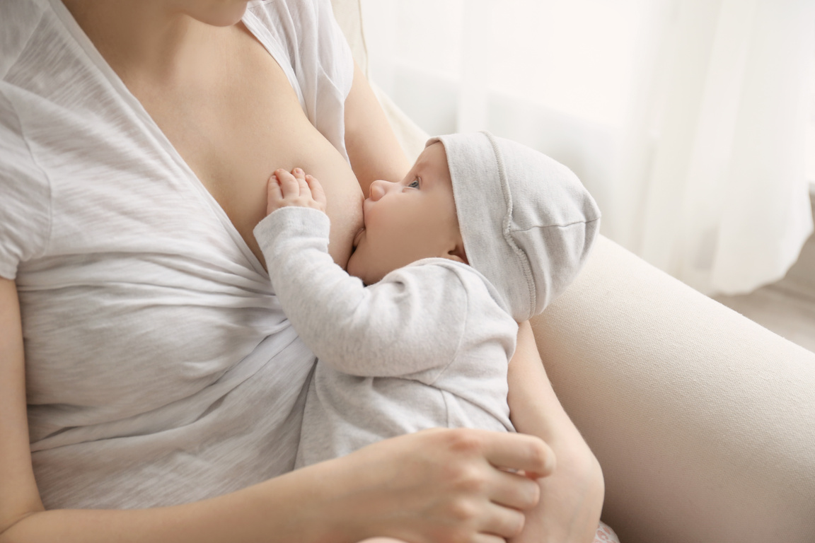 Woman Breastfeeding Her Little Baby